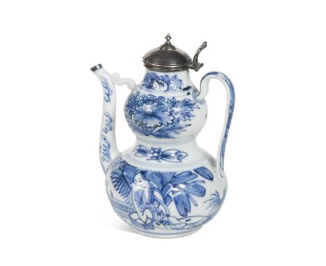A Chinese porcelain wine ewer, Kangxi,  painted in underglaze blue with foliate motifs and figure by a garden balustrade, lat