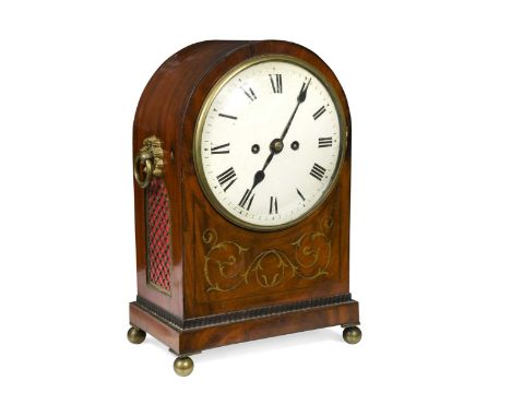 A Regency mahogany and brass inlaid bracket clock, the dome top case with side handles and white dial, Roman numerals, and tw