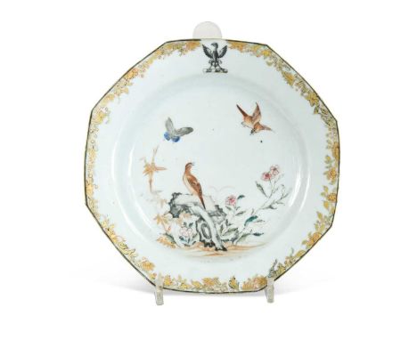 A Chinese famille rose crested octagonal porcelain dinner plate, Chen Lung, circa 1750, the gilt fruiting vine border with an