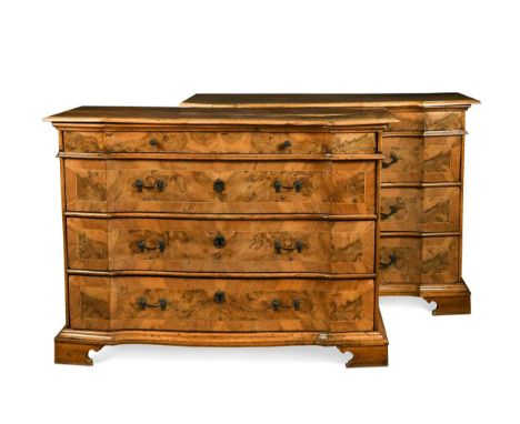 A pair of Italian walnut commodes, late 18th century, of serpentine form with four long graduating drawers on bracket feet102