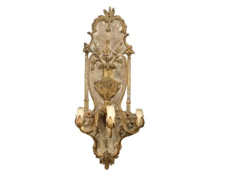 A French carved giltwood wall light, 18th century and later, the shaped back decorated with a vase of flowers between columns