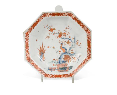 A Chelsea octagonal dish, circa 1752-1754, painted and gilt in kakiemon style with two phoenix-like birds, one perched on flo