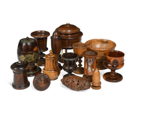 A collection of treen bowls and small boxes, 19th century, to include casters, spice boxes, wassail bowls, a brass mounted bo
