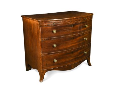 A George III mahogany bow fronted chest, circa 1790, with cushion moulded top edge, above a brushing slide and three graduate
