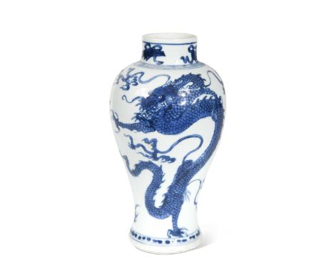 A Chinese blue and white porcelain dragon and phoenix vase, Kangxi (1662 - 1722), the animated mythical creature amongst lick
