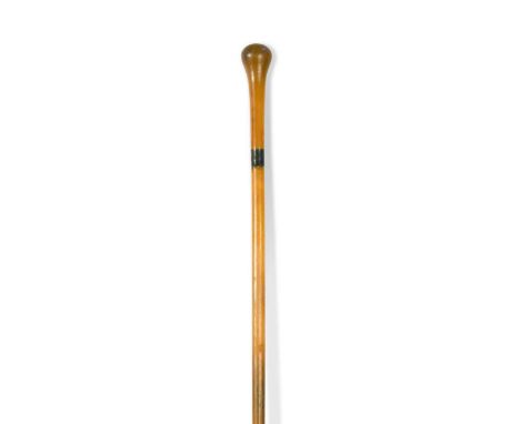A rhino horn walking stick, circa 1910,  applied with a silver coloured band engraved with a cartouche84cm longNon-UK bidders