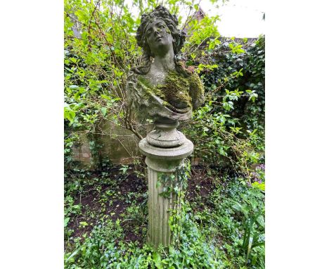 A reconstituted stone female bust in Art Nouveau style on socle base, 20th century, mounted on a fluted column203cm highWeath