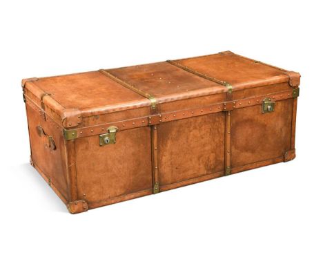 A rectangular leather trunk, 20th century, the hinged top enclosing a striped fabric lined interior, with side carrying handl