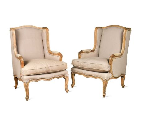 A pair of French style wingback armchairs, modern, with painted frames and grey upholstery, on cabriole legs102 x 73 x 63cmSt