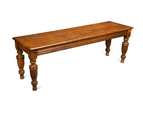 A late Victorian golden oak hall bench, with single piece top raised on ring-turned legs46 x 131 x 40cmExcellent original con