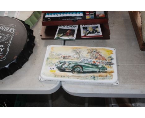 An enamel plaque depicting a Jaguar XK120