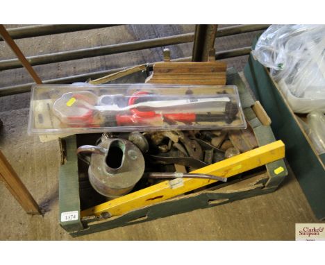 A box containing various tools to include planes; braces; levels; moulding planes and a copper small watering can