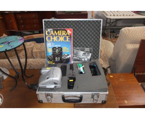A Canon A1 accessories kit together with a Polaroid camera