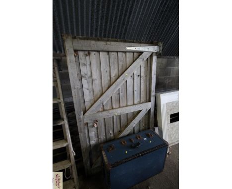 A wooden gate measuring approx. 47" wide x 70" tall