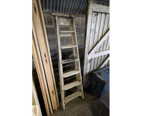 A seven step set of wooden folding steps
