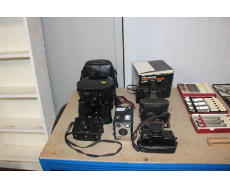 Two pairs of binoculars; various cameras; Polaroid Super Swinger land camera etc