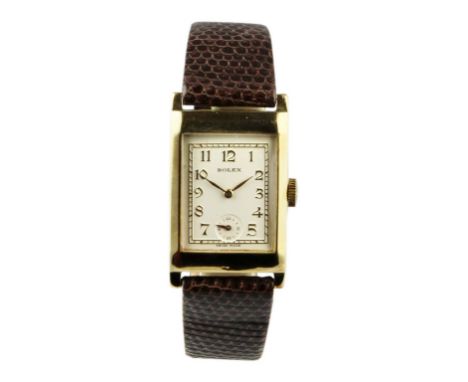 Rectangular shape with Rolex marked 15 jewel manual wind movement and Rolex signed case. The dial is creme with arabic numera