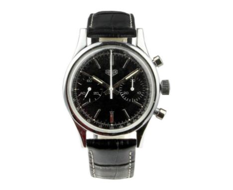 The stainless steel case measures 36mm and signed Heuer Leonidas in back. The dial is black with black sub-dials and black ta