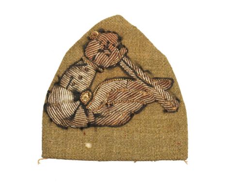 A triangular shaped Polish patch in the form of an armoured arm holding a sword, emblem of the 2nd Warsaw Armoured Division, 