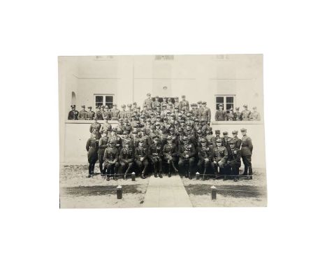 Photograph showing a group of Polish Army in company of an US officer. Visible many officers having multiple awards and badge