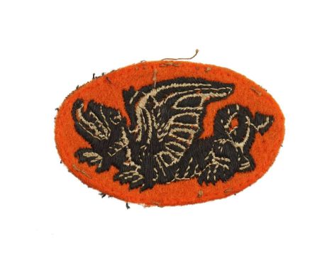 Oval patch in the form of a black embroidered dragon on an orange background. Emblem of the 16th Polish Armoured Brigade stat