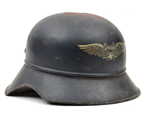 A Third Reich Luftschutz Bund steel helmet, decal intact but skull finish rather worn otherwise GC   