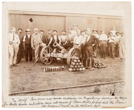 A rare original sepia photograph of the Siege of Mafeking, 8” x 6” depicting a group of 20 men including Baden Powell (on lef