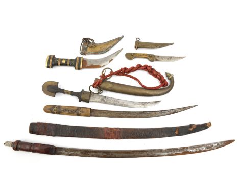 A N African jambiya, in sheath with belt loop; 2 other small jambiyas in sheaths; an African shortsword, blade 21”, leather c