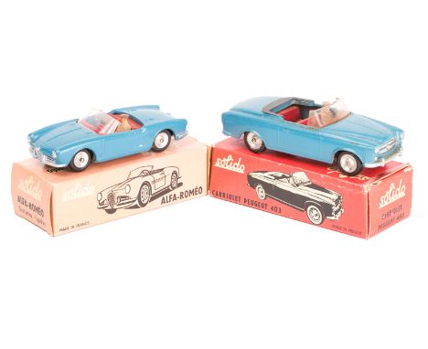 2 Solido sports cars. An Alfa Romeo Giulietta Spider in blue with red interior. A Peugeot 403 Cabriolet also in blue with red