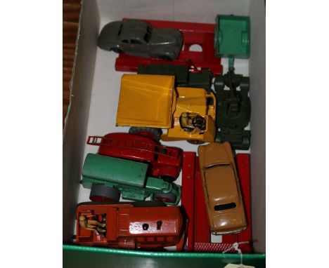 9 Dinky Toys. A Studebaker State Commander (39f) with dark grey body and black ridged wheels. A Ford Fordor Sedan (170) with 