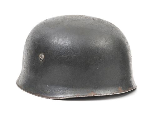A Third Reich Fallschirmjager helmet,  complete with chin harness, lining marked “Baumuster Heister, Berlin C2 Hersteller: F 
