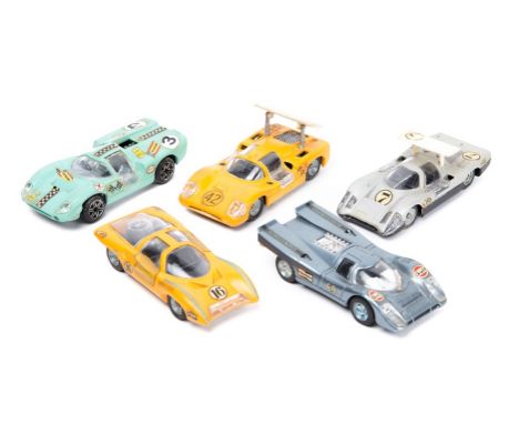 4 Politoys Export 1:43 scale sports racing cars. Lola Aston Martin in mint green RN3. Bertone Panther in sliver, RN7. Chaparr