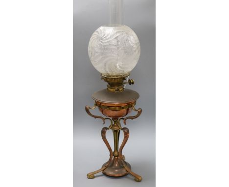 An Arts and Crafts copper and brass oil lamp overall height 69cm