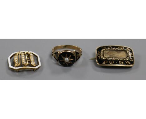 A George IV yellow metal and enamel mourning brooch, a 19th century child's? mourning ring and a yellow metal, seed pearl and