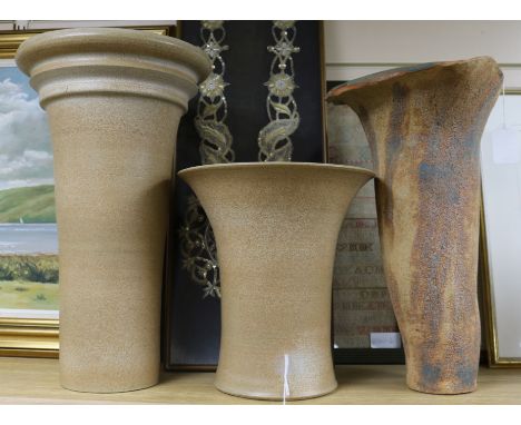 Two similar stoneware rhubarb forcers by Usch Spettigue and a tall planter by Irene Bell of tapered textured form, with evert