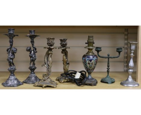 A pair of Putti candlesticks, two others and a lamp tallest 26cm