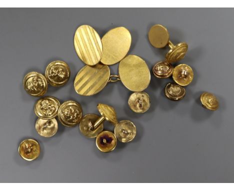 A pair of 18ct gold oval engine-turned cufflinks and a collection of gilt naval buttons, dress studs and cufflinks