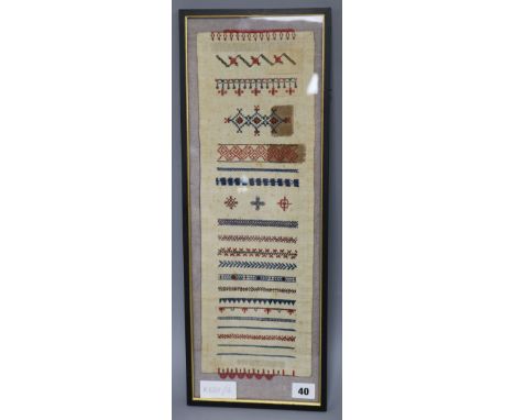 A 19th century Scandinavian sampler, framed, overall length 53.5cm