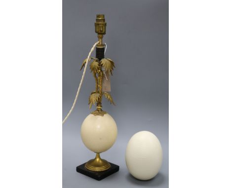 An ormolu and ostrich egg lamp and another egg shell overall height 52cm