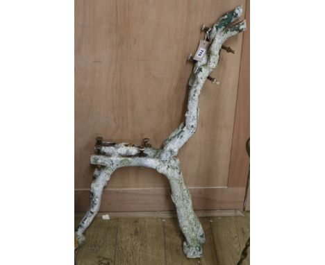 A pair of cast iron rustic garden bench ends