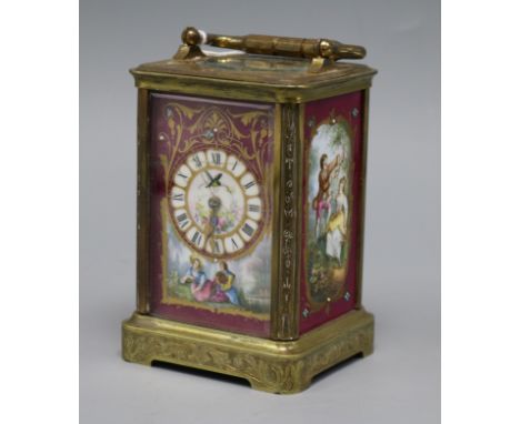 An ornate enamel faced timepiece height 12cm
