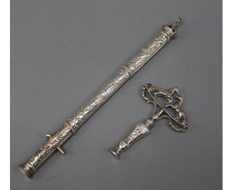 An embossed white metal seal case? and a white metal tamper? modelled as a travelling corkscrew.