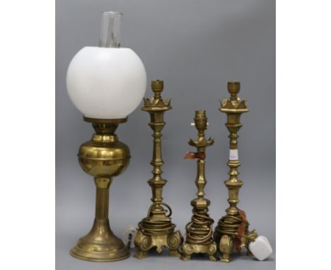 Three brass lamps and an oil lamp tallest 42cm