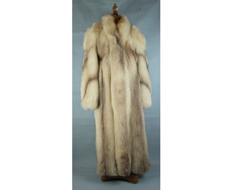 An arctic fox full-length fur coat by Rodulphe Fourres, Geneva, with cover.