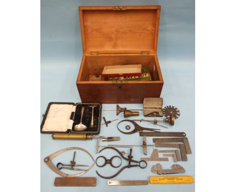 Four small steel set squares, five pairs of callipers and other engineering tools and a cased silver child's spoon and pusher