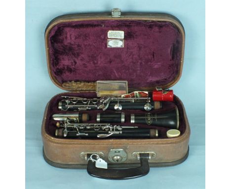 A Corton clarinet, cased.