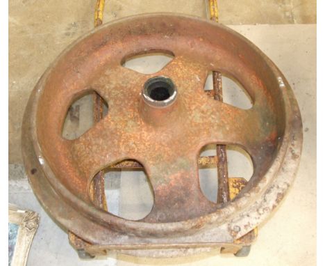 A cast iron railway engine bogie wheel, 75cm diameter.