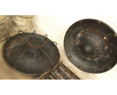 A cast iron animal feeding trough, 93cm diameter and another, (incomplete), (2).