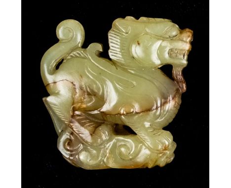 *Jade Carving. A Chinese jade carving of a mythical beast,  with ochre and rivering, possibly Ming Dynasty, 4.5cm long  (1)