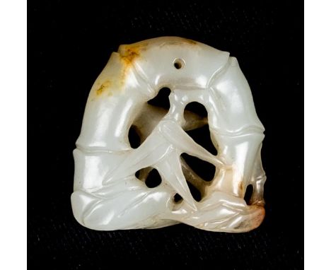 *Jade Carving. A Chinese mutton fat jade pendant,  carved as bamboo with ochre, pierced for suspension, Qing Dynasty, 3cm lon
